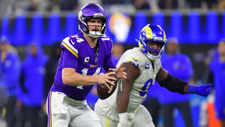 Oct 24, 2024; Inglewood, California, USA; Minnesota Vikings quarterback Sam Darnold (14) runs the ball against the Los Angeles Rams during the second half at SoFi Stadium. Mandatory Credit: Gary A. Vasquez-Imagn Images