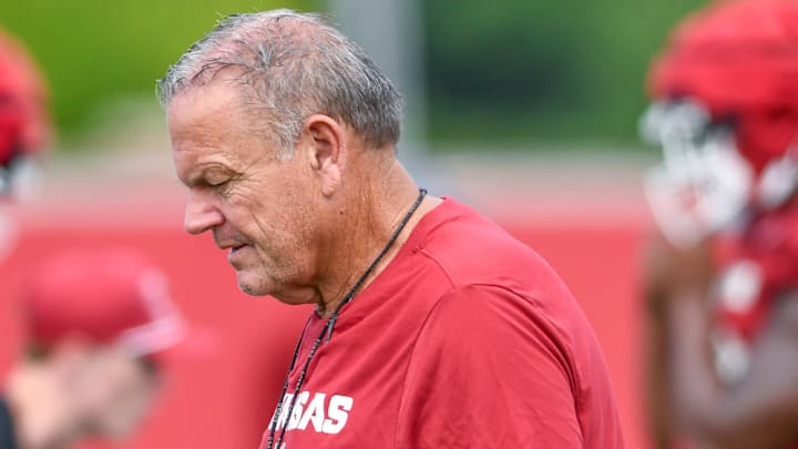 Arkansas Razorbacks coach Sam Pittman walking the outdoor practice field during preseason drills in Fayetteville, Ark. Arkansas Razorbacks coach Sam Pittman walking the outdoor practice field during preseason drills in Fayetteville, Ark.