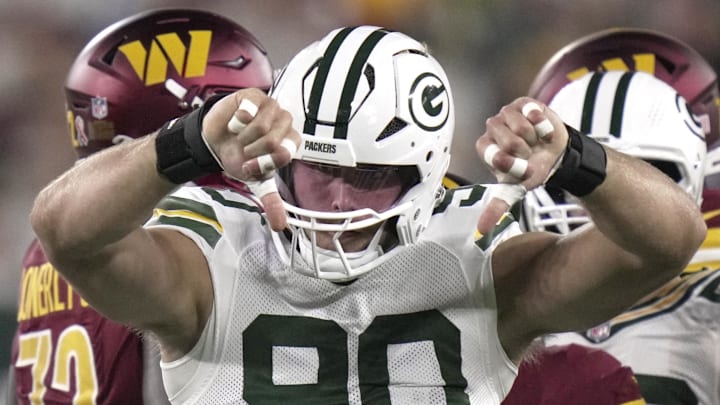 Green Bay Packers defensive end Lukas Van Ness (90) celebrates tackling Commanders running back Austin Ekeler for a loss. Green Bay Packers defensive end Lukas Van Ness (90) celebrates tackling Commanders running back Austin Ekeler for a loss.
