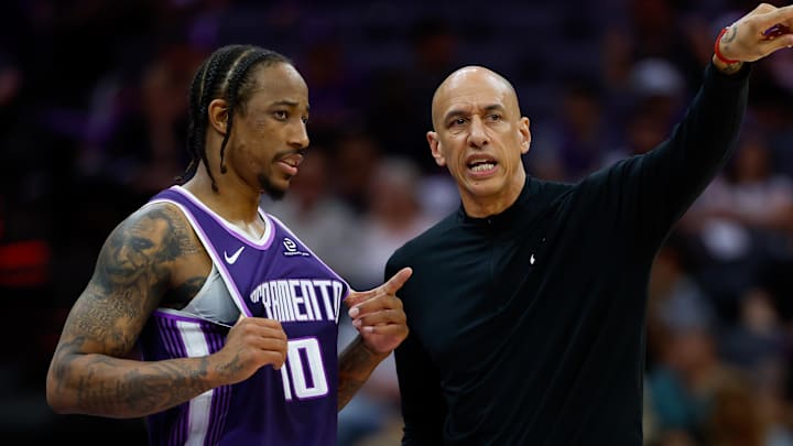 Mar 19, 2026; Sacramento, California, USA; Sacramento Kings guard DeMar DeRozan (10) is instructed by head coach Doug Christie during the fourth quarter against the Philadelphia 76ers at Golden 1 Center.