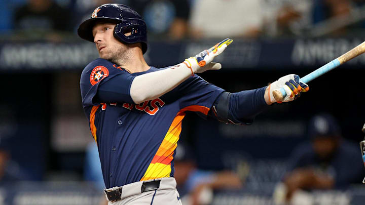 Aug 12, 2024; St. Petersburg, Florida, USA; Houston Astros third baseman Alex Bregman (2) hits a home run against the Tampa Bay Rays in the first inning  at Tropicana Field