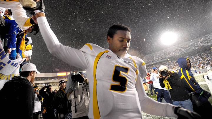 Dec 6, 2008; Morgantown, WV, USA; West Virginia Mountaineers quarterback Pat White (5) shakes hand with fans following his last football game as a collegiate player against the South Florida Bulls at Milan Puskar Stadium. Mandatory Credit: Don Wright-Imagn Images Dec 6, 2008; Morgantown, WV, USA; West Virginia Mountaineers quarterback Pat White (5) shakes hand with fans following his last football game as a collegiate player against the South Florida Bulls at Milan Puskar Stadium. Mandatory Credit: Don Wright-Imagn Images