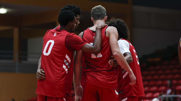 Indiana basketball guard Jasai Miles (0) huddles around forward Trent Sisley (11) during an exhibition game Aug. 6, 2025.