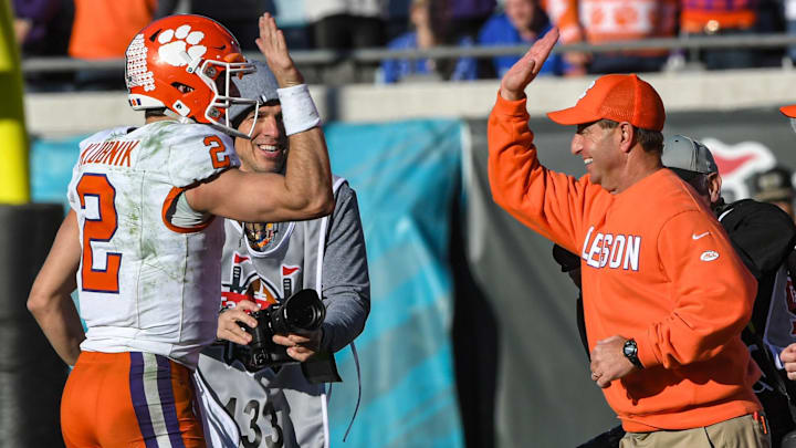 Clemson quarterback Cade Klubnik (2) gives a high five to Head Coach Dabo Swinney after the TaxSlayer Gator Bowl at EverBank Stadium in Jacksonville, Florida, Friday, December 29, 2023. Clemson beat Kentucky 38-35.