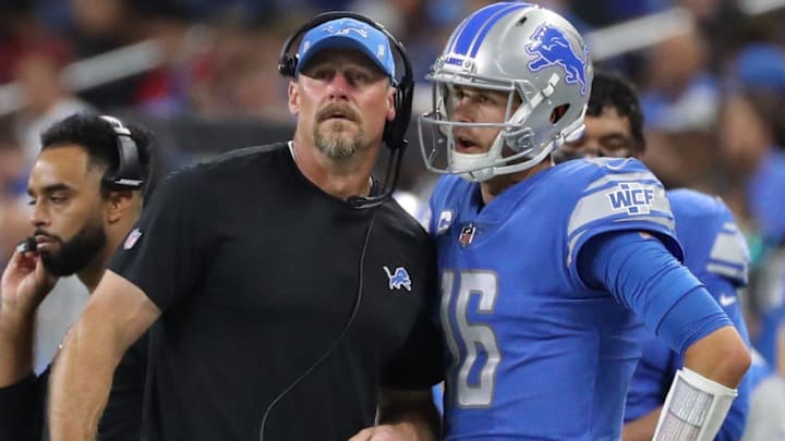 Detroit Lions head coach Dan Campbell and Detroit Lions QB Jared Goff talking on the sidelines. 