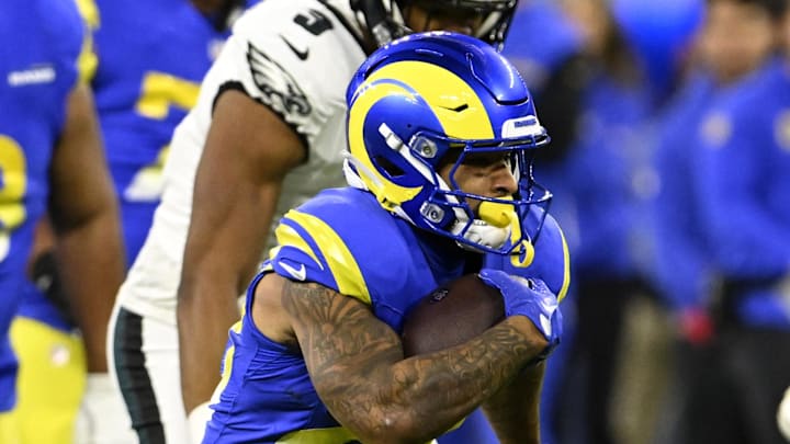 Nov 24, 2024; Inglewood, California, USA;  Los Angeles Rams running back Kyren Williams (23) runs past Philadelphia Eagles safety Reed Blankenship (32) during the first half at SoFi Stadium. Mandatory Credit: Alex Gallardo-Imagn Images