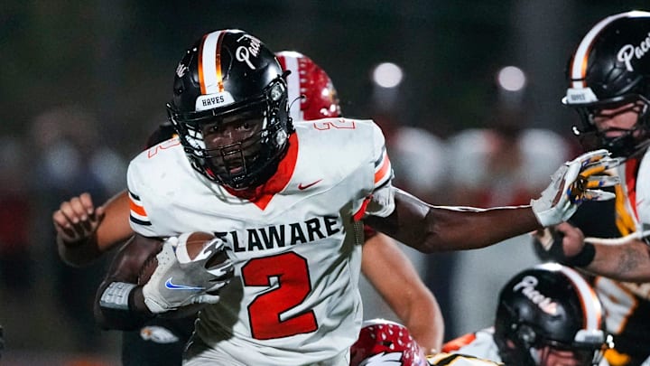 Sep 13, 2024; Sunbury, Ohio, USA; Delaware Hayes Favour Akih (2) runs the ball against Big Walnut in the second half at Big Walnut High School. Sep 13, 2024; Sunbury, Ohio, USA; Delaware Hayes Favour Akih (2) runs the ball against Big Walnut in the second half at Big Walnut High School.