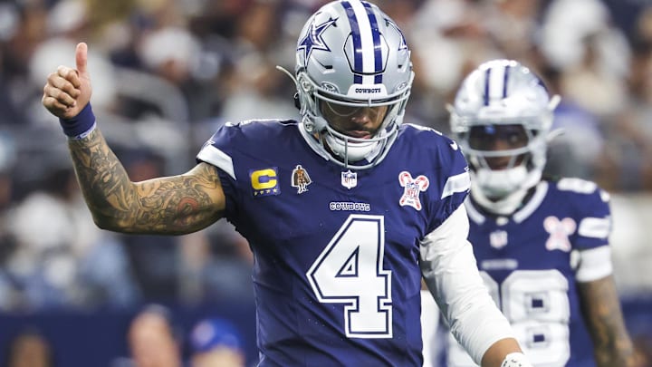 Dallas Cowboys quarterback Dak Prescott signals towards the sideline following a play against the Los Angeles Chargers.