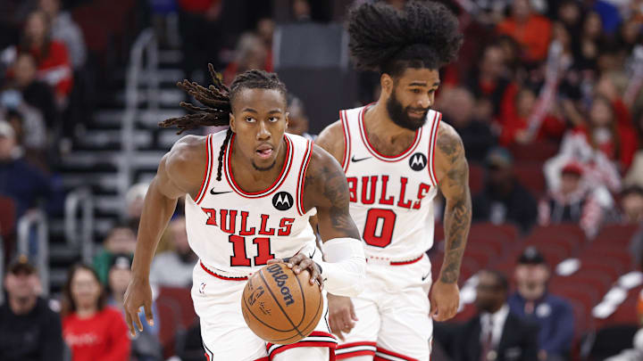 Jan 10, 2026; Chicago, Illinois, USA; Chicago Bulls guard Ayo Dosunmu (11) brings the ball up court against the Dallas Mavericks during the first half at United Center.
