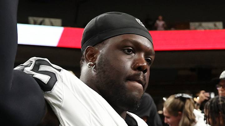 Las Vegas Raiders defensive end Kwity Paye jogs onto the field