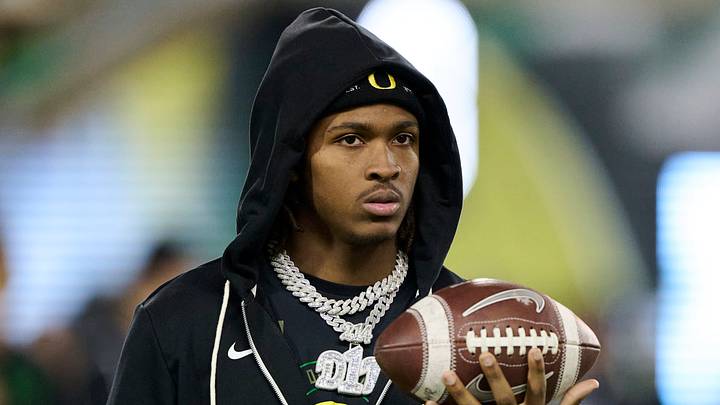 Nov 14, 2025; Eugene, Oregon, USA; Oregon Ducks wide receiver Dakorien Moore (1) watches teammates warm up before a game against the Minnesota Golden Gophers at Autzen Stadium. Mandatory Credit: Troy Wayrynen-Imagn Images Nov 14, 2025; Eugene, Oregon, USA; Oregon Ducks wide receiver Dakorien Moore (1) watches teammates warm up before a game against the Minnesota Golden Gophers at Autzen Stadium. Mandatory Credit: Troy Wayrynen-Imagn Images