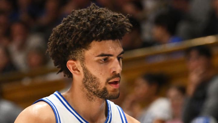 Feb 16, 2026; Durham, North Carolina, USA;  Duke Blue Devils forward Cameron Boozer (12) interacts with his teammates during the during the first half against the Syracuse Orange at Cameron Indoor Stadium. Mandatory Credit: Zachary Taft-Imagn Images