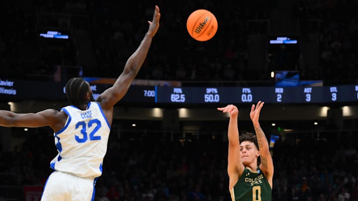 Mar 21, 2025; Seattle, WA, USA; Colorado State Rams guard Kyan Evans (0) shoots over Memphis Tigers center Moussa Cisse (32) during the first half at Climate Pledge Arena. Mandatory Credit: Steven Bisig-Imagn Images