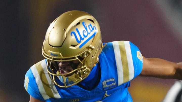 Nov 29, 2025; Los Angeles, California, USA; UCLA Bruins quarterback Nico Iamaleava (9) is tackled by Southern California Trojans linebacker Eric Gentry (18) in the second half at United Airlines Field at Los Angeles Memorial Coliseum. Mandatory Credit: Kirby Lee-Imagn Images Nov 29, 2025; Los Angeles, California, USA; UCLA Bruins quarterback Nico Iamaleava (9) is tackled by Southern California Trojans linebacker Eric Gentry (18) in the second half at United Airlines Field at Los Angeles Memorial Coliseum. Mandatory Credit: Kirby Lee-Imagn Images