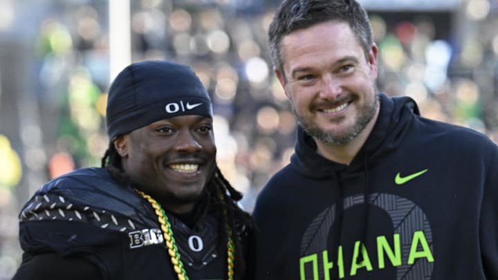 Nov 22, 2025; Eugene, Oregon, USA; Oregon Ducks running back Noah Whittington (6) poses for a photo with head coach Dan Lanning before the game against the Southern California Trojans at Autzen Stadium. Mandatory Credit: Troy Wayrynen-Imagn Images