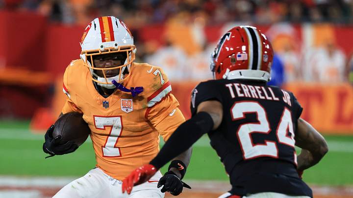 Tampa Bay Buccaneers running back Bucky Irving (7) runs the ball against Atlanta Falcons cornerback A.J. Terrell Jr. (24) Tampa Bay Buccaneers running back Bucky Irving (7) runs the ball against Atlanta Falcons cornerback A.J. Terrell Jr. (24)