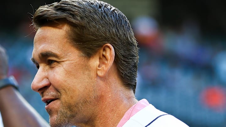 Former Seattle Mariners player Bret Boone smiles during pregame activities
