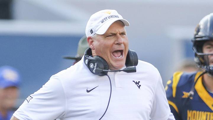 Sep 13, 2025; Morgantown, West Virginia, USA; West Virginia Mountaineers head coach Rich Rodriguez yells at the referee during the second quarter against the Pittsburgh Panthers at Milan Puskar Stadium. Mandatory Credit: Ben Queen-Imagn Images