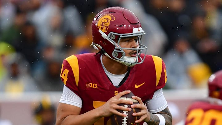 Nov 15, 2025; Los Angeles, California, USA; Southern California Trojans quarterback Jayden Maiava (14) moves out to pass against the Iowa Hawkeyes during the first half at the Los Angeles Memorial Coliseum. Mandatory Credit: Gary A. Vasquez-Imagn Images
