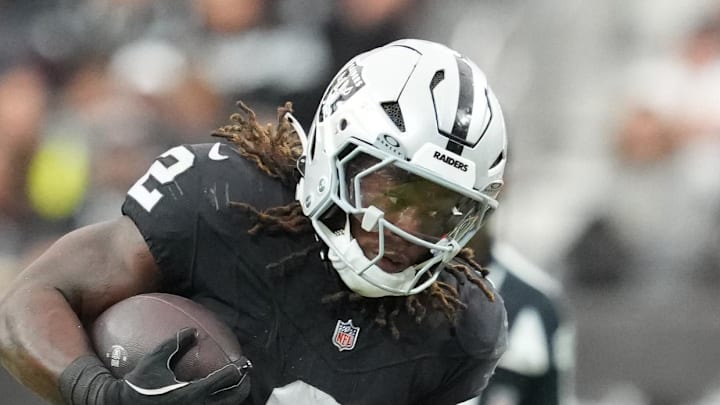 Nov 23, 2025; Paradise, Nevada, USA; Las Vegas Raiders running back Ashton Jeanty (2) runs against Cleveland Browns linebacker Devin Bush (30) in the first half at Allegiant Stadium. Mandatory Credit: Stephen R. Sylvanie-Imagn Images
