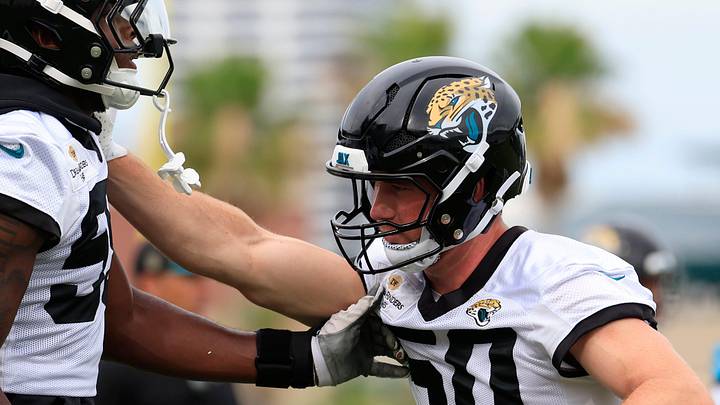 Jacksonville Jaguars linebacker Branson Combs (50) defends against defensive end Quindarius Dunnigan (59) during the first day of minicamp at the Miller Electric Center, Tuesday, June 9, 2026, in Jacksonville, Fla.