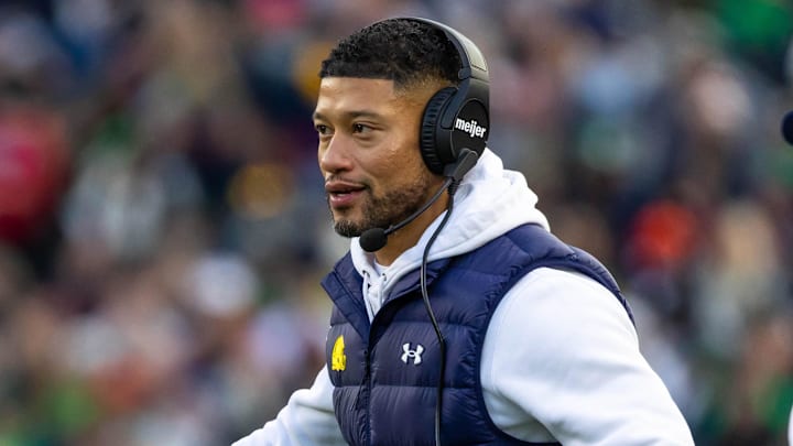 Nov 22, 2025; South Bend, Indiana, USA; Notre Dame Fighting Irish head coach Marcus Freeman celebrates with players after scoring against the Syracuse Orange during the first half at Notre Dame Stadium. Mandatory Credit: Michael Caterina-Imagn Images