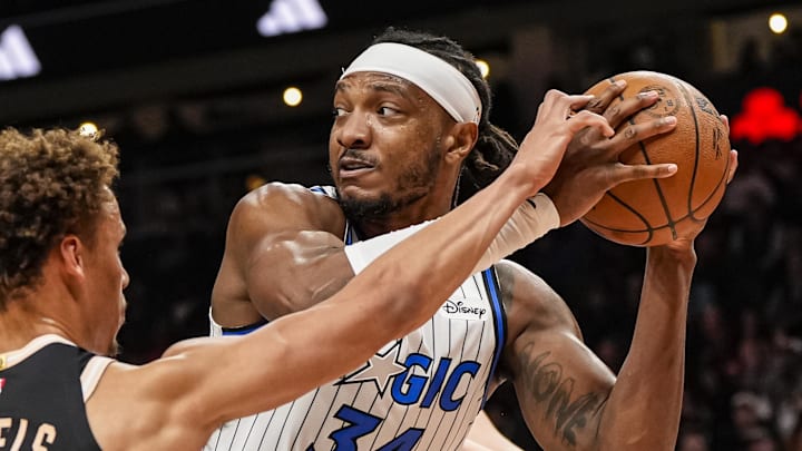 Mar 16, 2026; Atlanta, Georgia, USA; Orlando Magic center Wendell Carter Jr. (34) protects the ball from Atlanta Hawks guard Dyson Daniels (5) during the first half at State Farm Arena. Mandatory Credit: Dale Zanine-Imagn Images