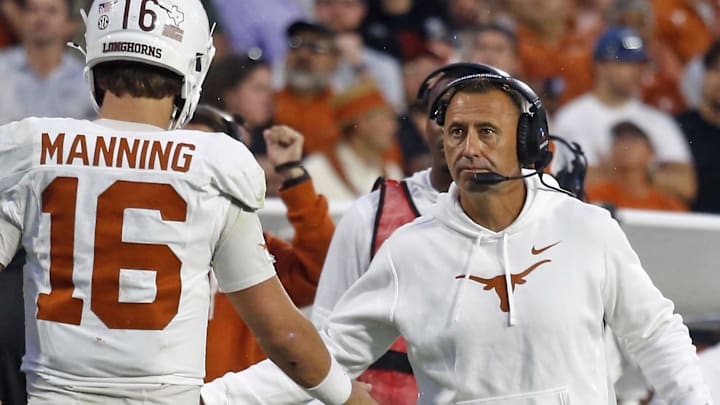 Texas Longhorns head coach Steve Sarkisian reacts with Texas Longhorns quarterback Arch Manning during the fourth quarter against the Mississippi State Bulldogs at Davis Wade Stadium at Scott Field. 