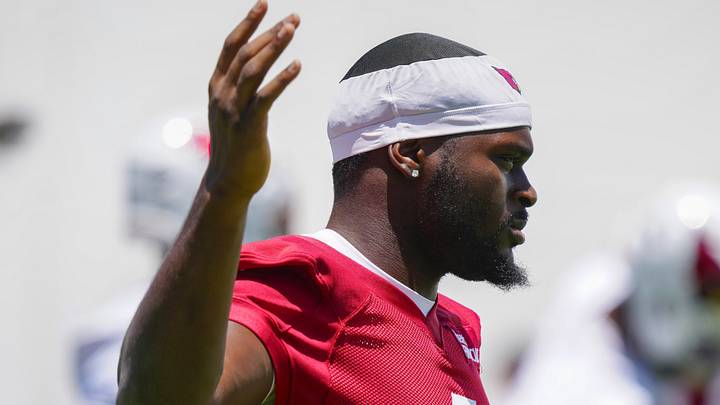 Cardinals running back Jeremiyah Love (4) warms up during organized team activities at the Cardinals Training Facility in Tempe on May 27, 2026.