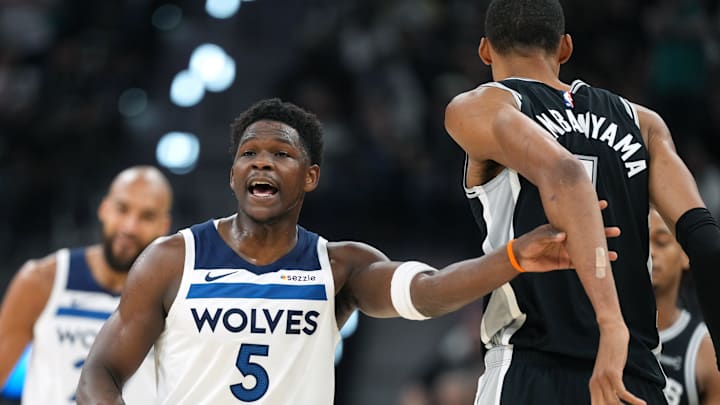 May 12, 2026; San Antonio, Texas, USA; Minnesota Timberwolves guard Anthony Edwards (5) grabs San Antonio Spurs forward Victor Wembanyama (1) during the first half of game five of the second round of the 2026 NBA Playoffs at Frost Bank Center. Mandatory Credit: Scott Wachter-Imagn Images