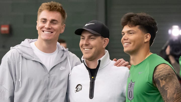 Denver Broncos quarterback Bo Nix, a former Oregon quarterback, left, and Oregon quarterback Dillon Gabriel, right, take a picture with Oregon offensive coordinator and quarterbacks coach Will Stein during the Oregon football’s Pro Day Tuesday, March 18, 2025, at the Moshofsky Center in Eugene, Ore.
