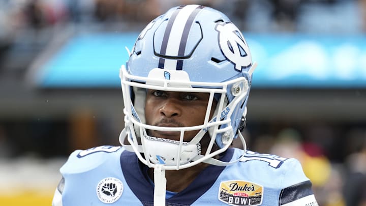 Dec 30, 2021; Charlotte, NC, USA; North Carolina Tar Heels running back Ty Chandler (19) during the first quarter against the South Carolina Gamecocks at Bank of America Stadium. Mandatory Credit: Jim Dedmon-Imagn Images Dec 30, 2021; Charlotte, NC, USA; North Carolina Tar Heels running back Ty Chandler (19) during the first quarter against the South Carolina Gamecocks at Bank of America Stadium. Mandatory Credit: Jim Dedmon-Imagn Images