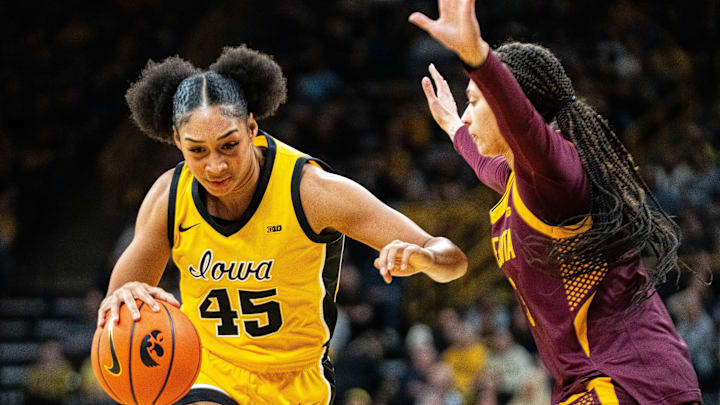 Iowa forward Hannah Stuelke (45) drives to the basket against Minnesota guard Amaya Battle (3) on Feb. 5, 2026, at Carver-Hawkeye Arena. Iowa forward Hannah Stuelke (45) drives to the basket against Minnesota guard Amaya Battle (3) on Feb. 5, 2026, at Carver-Hawkeye Arena.