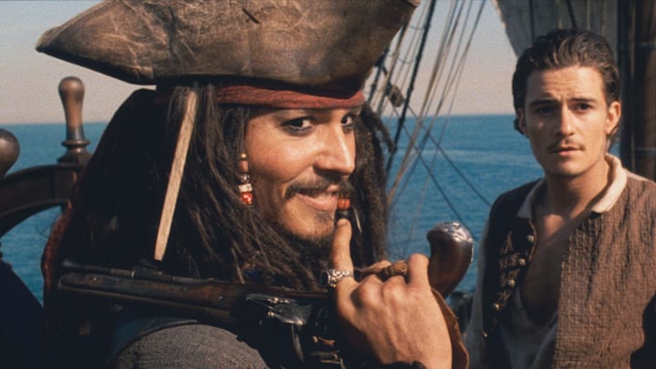Johnny Depp and Orlando Bloom in Pirates of the Caribbean: The Curse of the Black Pearl