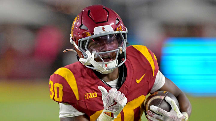 Oct 11, 2025; Los Angeles, California, USA; USC Trojans running back King Miller (30) runs for a touchdown in the second half against the Michigan Wolverines at United Airlines Field at the Los Angeles Memorial Coliseum. Mandatory Credit: Jayne Kamin-Oncea-Imagn Images Oct 11, 2025; Los Angeles, California, USA; USC Trojans running back King Miller (30) runs for a touchdown in the second half against the Michigan Wolverines at United Airlines Field at the Los Angeles Memorial Coliseum. Mandatory Credit: Jayne Kamin-Oncea-Imagn Images