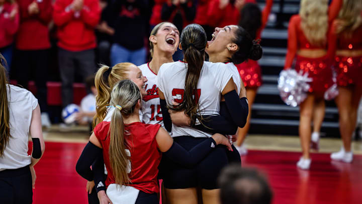 The Huskers celebrate a one-handed, behind-the-court save from Teraya Sigler. The play was part of a 5-0 run that helped Nebraska win the first set.