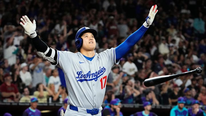 Los Angeles Dodgers Shohei Ohtani tosses his bat after hitting a three run home run against the Arizona Diamondbacks in the ninth inning at Chase Field in Phoenix on May 9, 2025. Mandatory Credit: Rob Schumacher-Arizona Republic