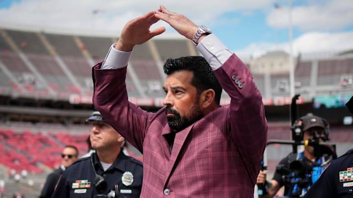 Ohio State Buckeyes head coach Ryan Day gives students an I-O response to their O-H while walking across the field as the team arrives prior to the NCAA football game against the Grambling State Tigers at Ohio Stadium on Sept. 6, 2025.