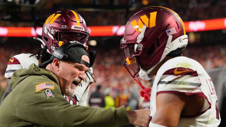Oct 27, 2025; Kansas City, Missouri, USA; Washington Commanders head coach Dan Quinn celebrates an interception against the Kansas City Chiefs with Washington Commanders cornerback Marshon Lattimore (2) during the first quarter of the game at GEHA Field at Arrowhead Stadium. Mandatory Credit: Jay Biggerstaff-Imagn Images Oct 27, 2025; Kansas City, Missouri, USA; Washington Commanders head coach Dan Quinn celebrates an interception against the Kansas City Chiefs with Washington Commanders cornerback Marshon Lattimore (2) during the first quarter of the game at GEHA Field at Arrowhead Stadium. Mandatory Credit: Jay Biggerstaff-Imagn Images