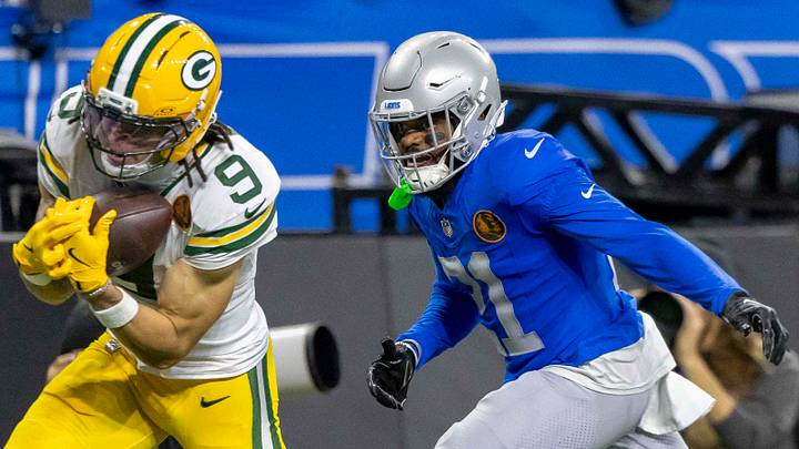 Nov 27, 2025; Detroit, Michigan, USA; Green Bay Packers wide receiver Christian Watson (9) catches a pass against Detroit Lions cornerback Amik Robertson (21) during the third quarter at Ford Field. Mandatory Credit: David Reginek-Imagn Images Nov 27, 2025; Detroit, Michigan, USA; Green Bay Packers wide receiver Christian Watson (9) catches a pass against Detroit Lions cornerback Amik Robertson (21) during the third quarter at Ford Field. Mandatory Credit: David Reginek-Imagn Images