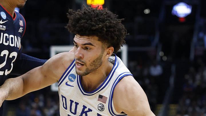 Mar 29, 2026; Washington, DC, USA; Duke Blue Devils forward Cameron Boozer (12) goes to the basket against UConn Huskies forward Jayden Ross (23) in the first half during an Elite Eight game of the East Regional of the men's 2026 NCAA Tournament at Capital One Arena. Mandatory Credit: Amber Searls-Imagn Images