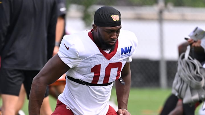 Aug 6, 2025; Foxborough, MA, USA; Washington Commanders wide receiver Jacoby Jones (10) stretches at training camp at Gillette Stadium. Mandatory Credit: Eric Canha-Imagn Images