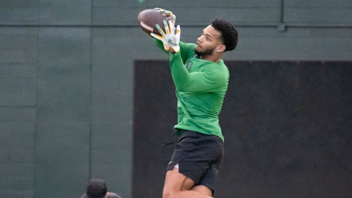 Oregon defensive back Kam Alexander catches a pass during the Oregon football’s Pro Day Tuesday, March 18, 2025, at the Moshofsky Center in Eugene, Ore. Oregon defensive back Kam Alexander catches a pass during the Oregon football’s Pro Day Tuesday, March 18, 2025, at the Moshofsky Center in Eugene, Ore.