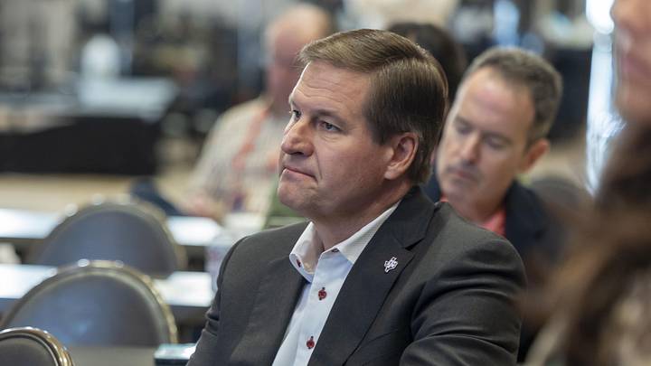 Oct 15, 2025; Birmingham, AL, USA; Texas A&M Aggies athletic director Trev Alberts watches as head coach Bucky McMillan talks with the media during SEC Media Days at Grand Bohemian Hotel. Mandatory Credit: Vasha Hunt-Imagn Images Oct 15, 2025; Birmingham, AL, USA; Texas A&M Aggies athletic director Trev Alberts watches as head coach Bucky McMillan talks with the media during SEC Media Days at Grand Bohemian Hotel. Mandatory Credit: Vasha Hunt-Imagn Images