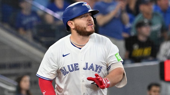 Jun 4, 2025; Toronto, Ontario, CAN;  Toronto Blue Jays catcher Alejandro Kirk (30) hits a walkoff RBI double against the Philadelphia Phillies in the ninth inning at Rogers Centre