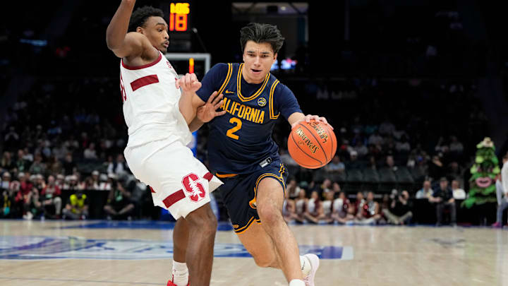 Mar 12, 2025; Charlotte, NC, USA; California Golden Bears guard Andrej Stojakovic (2) with the ball as Stanford Cardinal guard Jaylen Blakes (21) defends in the second half at Spectrum Center. Mandatory Credit: Bob Donnan-Imagn Images