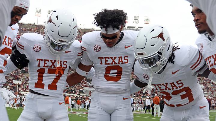 Texas Longhorns defensive backs Xavier Filsaime, Jonah Williams and Jordon Johnson-Rubell huddle up during warm-ups before the game against the Mississippi State Bulldogs at Davis Wade Stadium at Scott Field. Texas Longhorns defensive backs Xavier Filsaime, Jonah Williams and Jordon Johnson-Rubell huddle up during warm-ups before the game against the Mississippi State Bulldogs at Davis Wade Stadium at Scott Field.