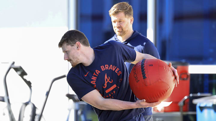 Atlanta Braves catcher Sean Murphy (12) works out during spring training workouts. Atlanta Braves catcher Sean Murphy (12) works out during spring training workouts.