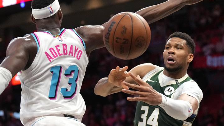 Apr 5, 2025; Miami, Florida, USA; Milwaukee Bucks forward Giannis Antetokounmpo (34) passes the ball under the arm of Miami Heat center Bam Adebayo (13) during overtime at Kaseya Center. Mandatory Credit: Jim Rassol-Imagn Images Apr 5, 2025; Miami, Florida, USA; Milwaukee Bucks forward Giannis Antetokounmpo (34) passes the ball under the arm of Miami Heat center Bam Adebayo (13) during overtime at Kaseya Center. Mandatory Credit: Jim Rassol-Imagn Images