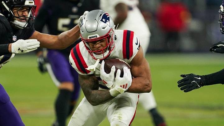 Dec 21, 2025; Baltimore, Maryland, USA; New England Patriots running back Treveyon Henderson (32) runs the ball against Baltimore Ravens safety Kyle Hamilton (14) during the first half of the game at M&T Bank Stadium. Mandatory Credit: Mitch Stringer-Imagn Images Dec 21, 2025; Baltimore, Maryland, USA; New England Patriots running back Treveyon Henderson (32) runs the ball against Baltimore Ravens safety Kyle Hamilton (14) during the first half of the game at M&T Bank Stadium. Mandatory Credit: Mitch Stringer-Imagn Images